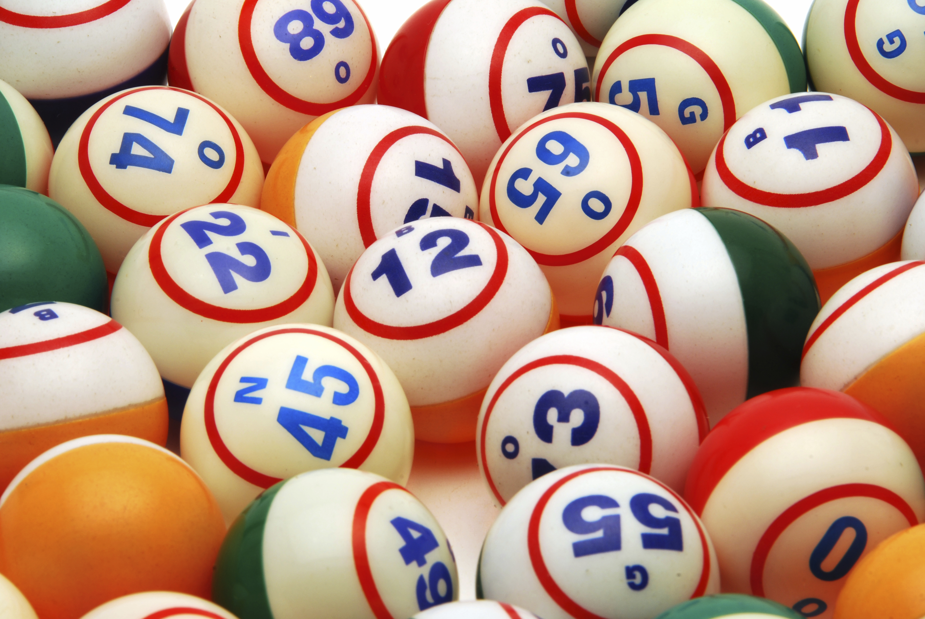 colorful balls with numbers on them that are used for bingo